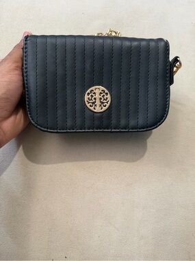 Black Quilted Crossbody Bag with Gold Emblem